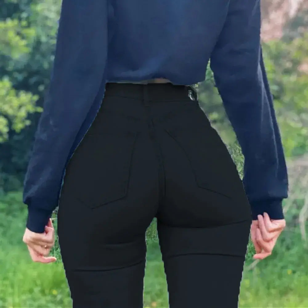 Les leggings noirs à taille haute ou les pantalons moulants portés par une personne.